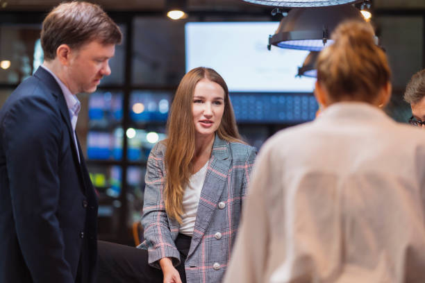 istock Rebranding Help Your Business Move into present success today. Business Development Teamwork standing discuss during a meeting conference about improve rebranding and strategy setting by focusing on the future target market in a modern interior business 1412797983