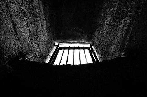 Image looking up from the prison to the upper fence
