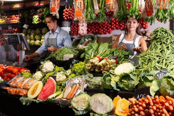 istock Two sellers working behind the counter 1412805603