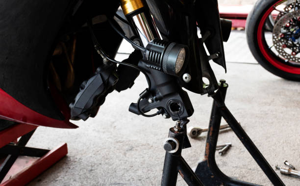 istock Front view motorcycle up to stand to remove wheel to change tire 1412808846