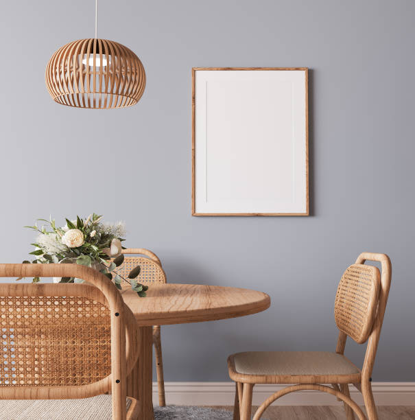 Frame mockup in Scandinavian wooden dining room, minimal bright design on gray interior background stock photo