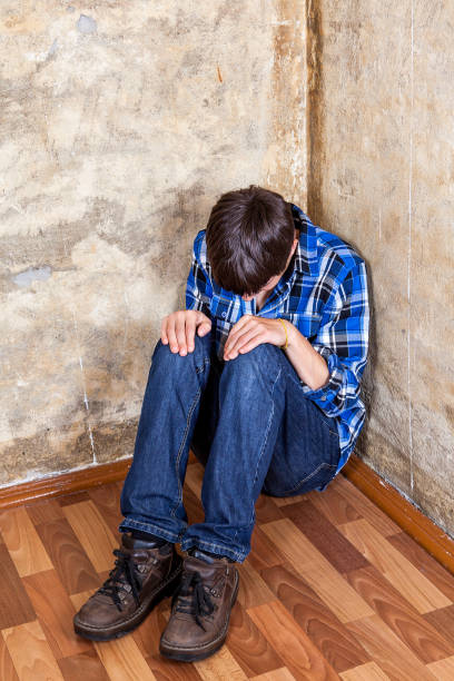 istock Sad Teen in the Corner 1412812055