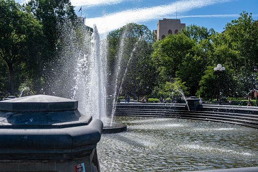 Manhattan, New York City - June 6, 2022 - Fountains at washinghton square Park during a sunday morning