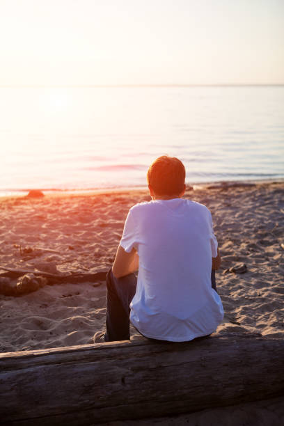 istock Lonely Young Man outdoor 1412817409
