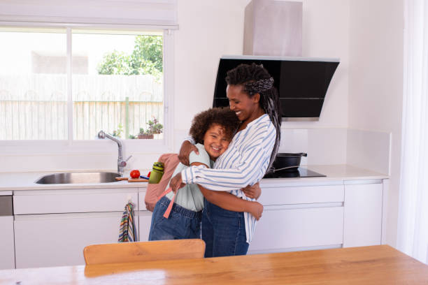 istock Loving mother and school daughter hugging. 1412818639