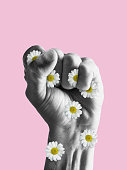 istock Human fist full of flowers. Stop war and violence. Modern design, contemporary art collage. Inspiration, idea, trendy urban magazine style. 1412821488
