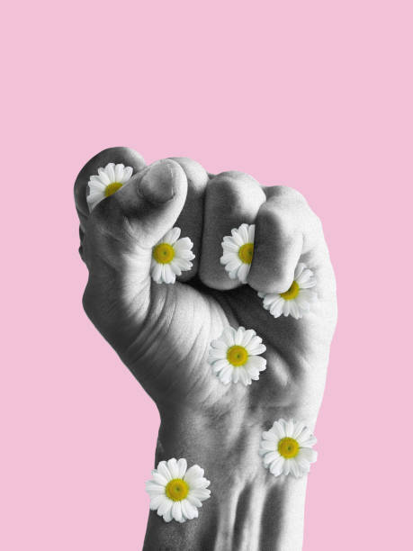 Human fist full of flowers. Stop war and violence. Modern design, contemporary art collage. Inspiration, idea, trendy urban magazine style. stock photo