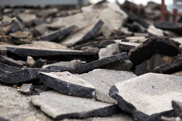 istock Damaged road with pieces of broken asphalt part 1412821786