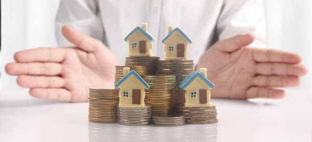 istock House Residential Structure in  hand 1412822410