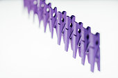 Purple Clothes Pegs in a Row