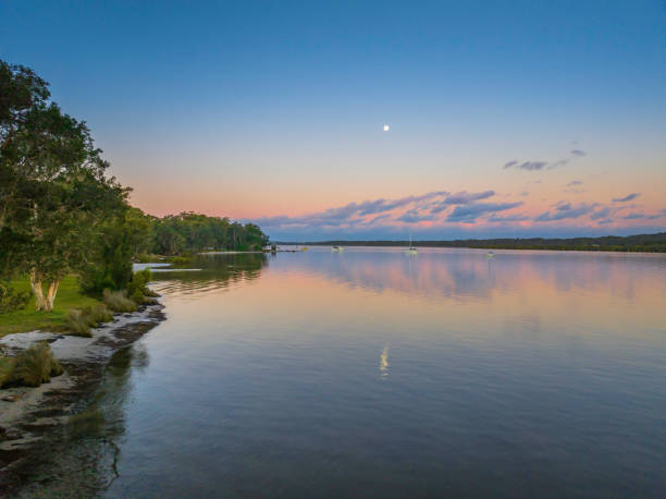 istock Sunset over the river with boats 1412829033