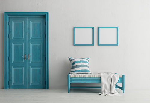 Santorini style interior with bench door and blank picture frame.3d rendering