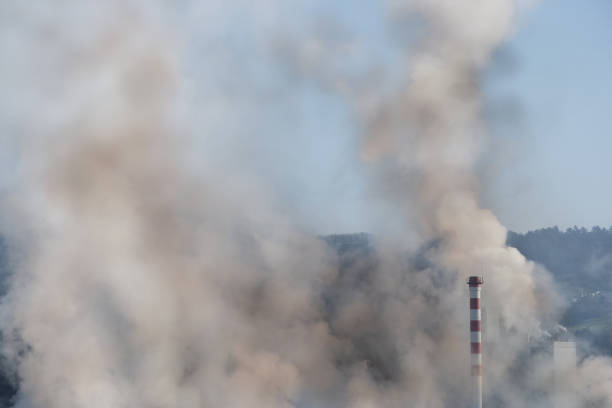 istock Fumes and pollution in factory chimneys 1412834849