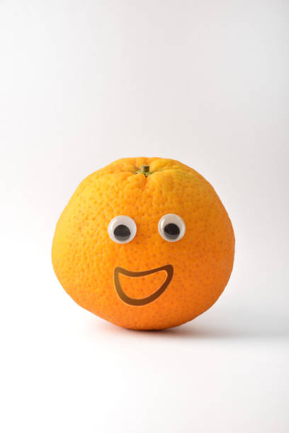 istock Healthy orange with face on white isolated background 1412835267