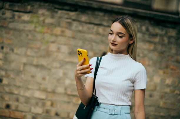 istock teenager girl using smart phone 1412835843
