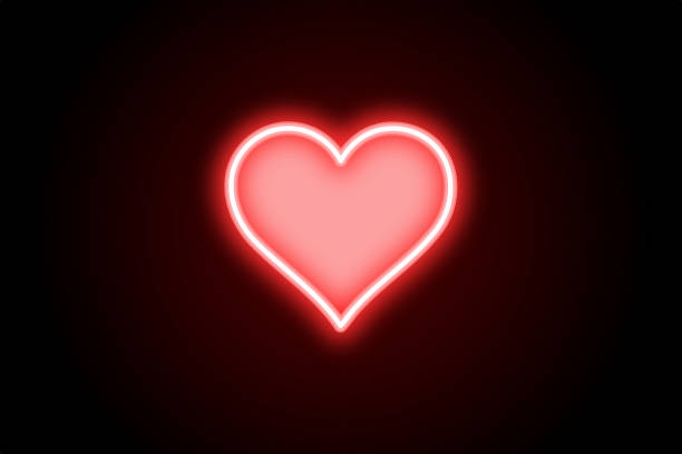 istock Glowing neon red heart love on black background 1412838496