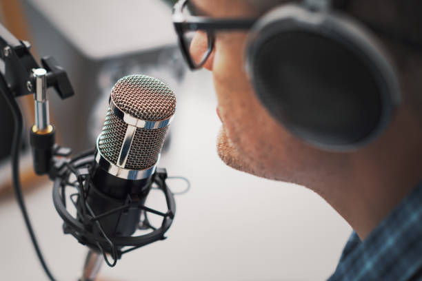 istock Professional speaker recording a live podcast 1412839286