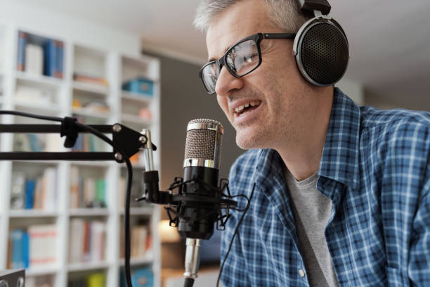 istock Professional speaker recording a live podcast 1412839488