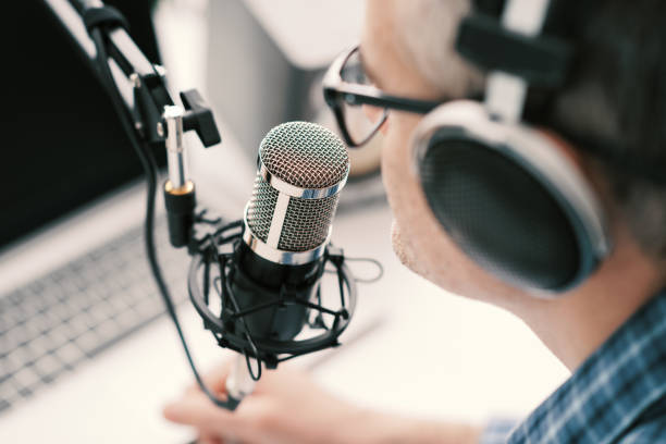 istock Professional speaker recording a live podcast 1412839686