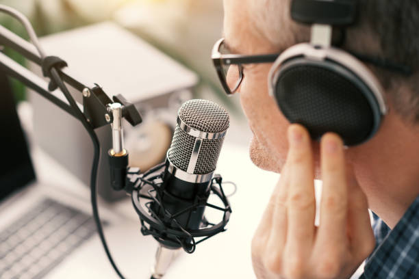 istock Professional speaker recording a live podcast 1412839758