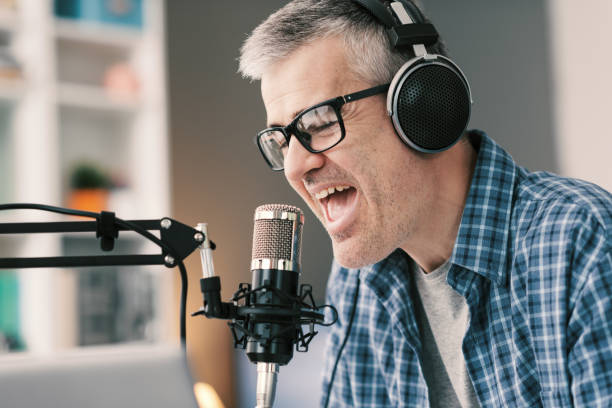 istock Professional speaker recording a live podcast 1412840292