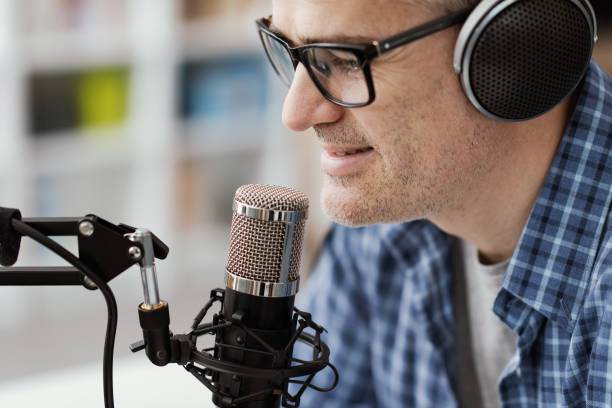 istock Man recording audio podcast 1412840447