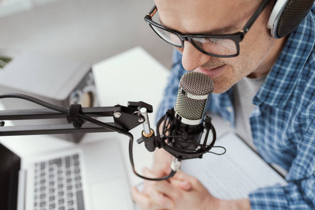 istock Man recording audio podcast 1412840524