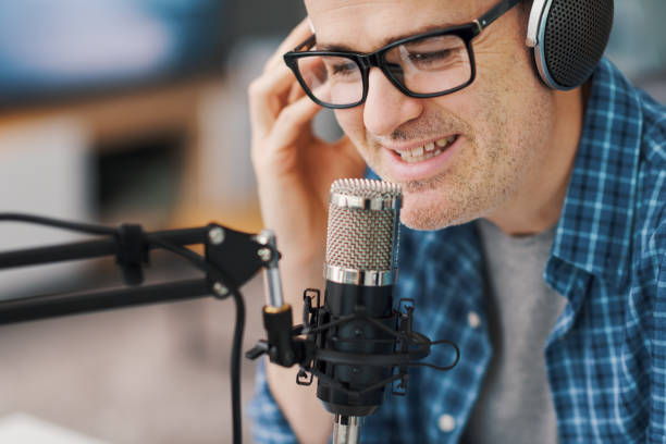 istock Man recording audio podcast 1412840543