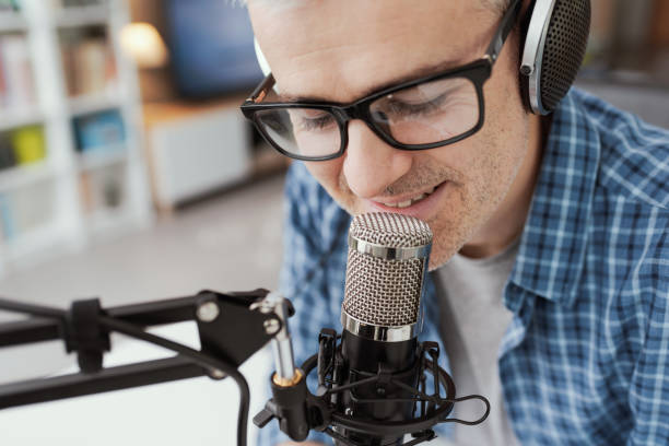 istock Man recording audio podcast 1412840601