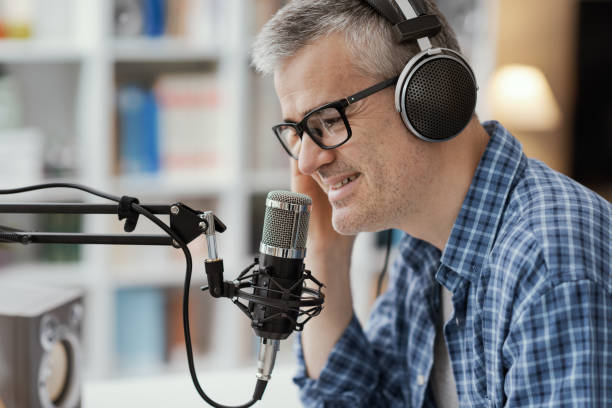 istock Man recording audio podcast 1412840644
