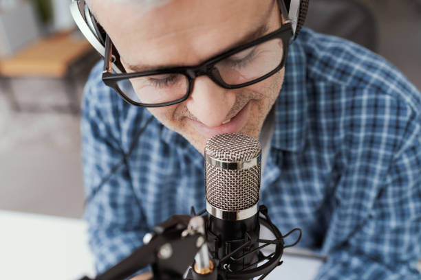 istock Man recording audio podcast 1412840673