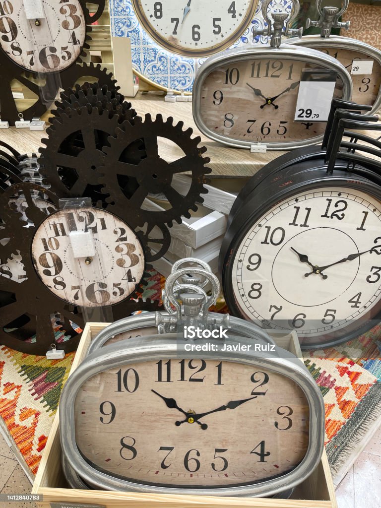 a display with a group of vintage watches, concept of time passing by, antique watches imitation, wall clock a display with a group of vintage watches, concept of time passing by, antique watches imitation, wall clock, vertical Accuracy Stock Photo