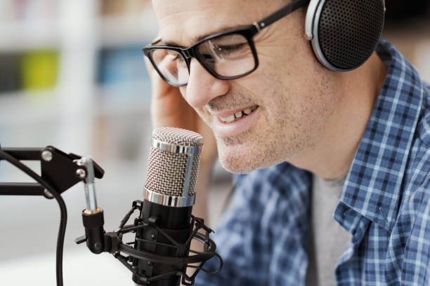 istock Man recording audio podcast 1412840787