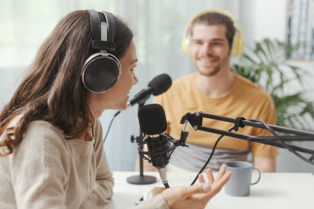 Young speakers doing a live podcast stock photo