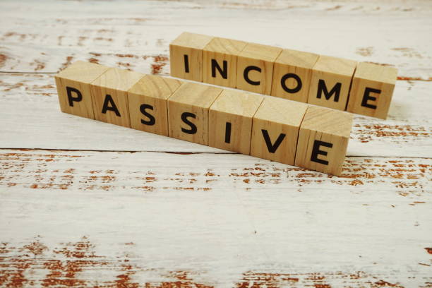 istock Passive Income Word alphabet letters on wooden background 1412842389