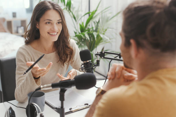 Young speaker conducting a podcast interview stock photo
