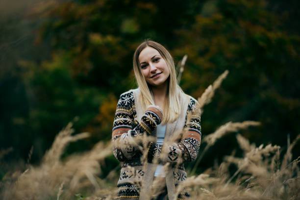 istock Happy woman hiking in mountains 1412842603