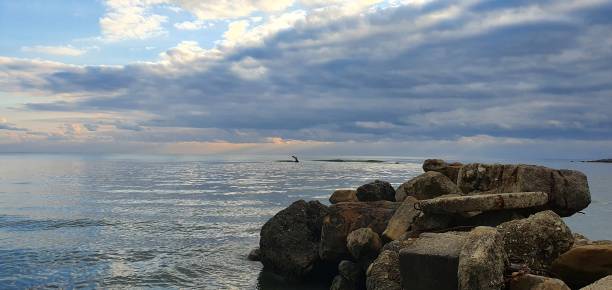 istock Cloudy sky and the seaside on Dzhubga beach 1412842789