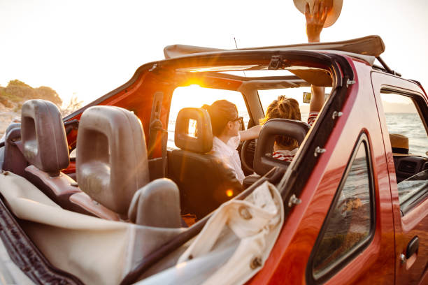 istock Girls on a summer road trip and using smart phone 1412843025
