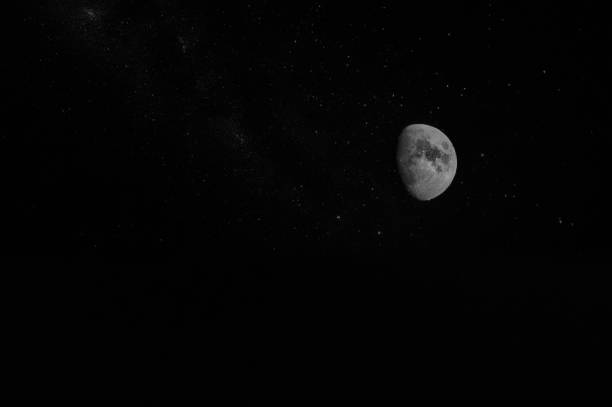 istock Almost full Moon and glistening stars 1412843309