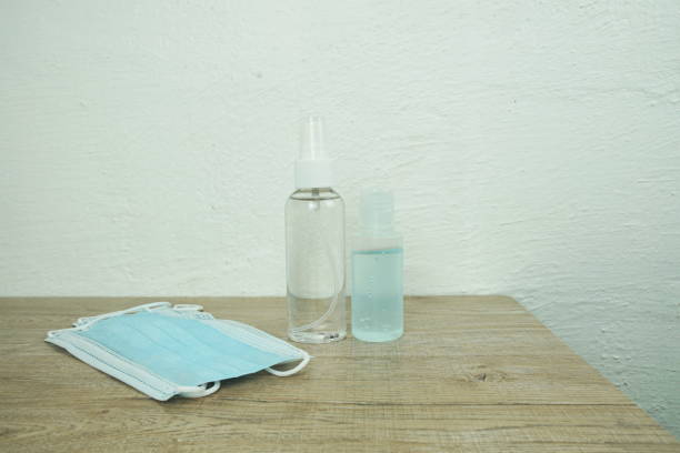istock Surgical Mask with alcohol gel and spray 1412843986