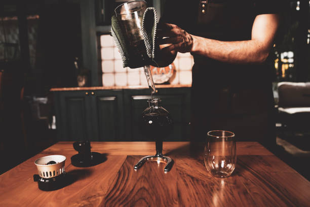 istock barista brewing coffee in the coffee room 1412846520