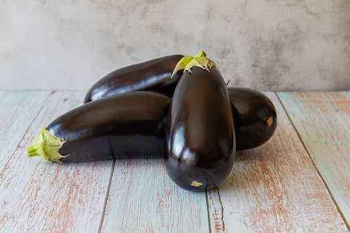 Ripe eggplants in a bountiful autumn garden, showcasing the rich colors and flavors of the season's harvest