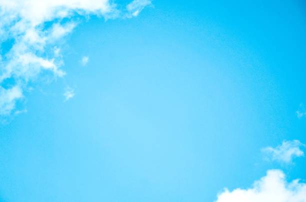 Blue sky blank space background with forming clouds in sunny day outdoors