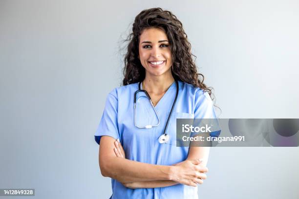 Portrait Of A Young Nurse Doctor Stock Photo - Download Image Now - Female Nurse, Medical Scrubs, Latin American and Hispanic Ethnicity