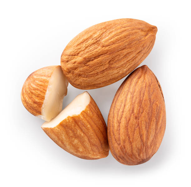istock Almond isolated. Almonds on white background. Two whole almonds and a half top view. With clipping path. Full depth of field. 1412849465