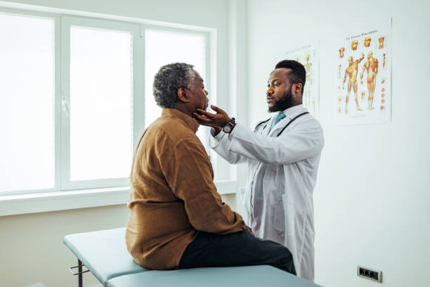 istock male doctor palpating patients submandibular lymph nodes 1412852061