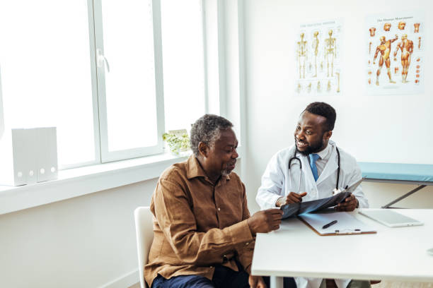 istock Male doctor explaining x-rays to mature patient 1412852140