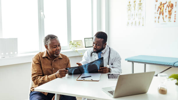 istock Doctor and patient discussing good X ray results 1412852163
