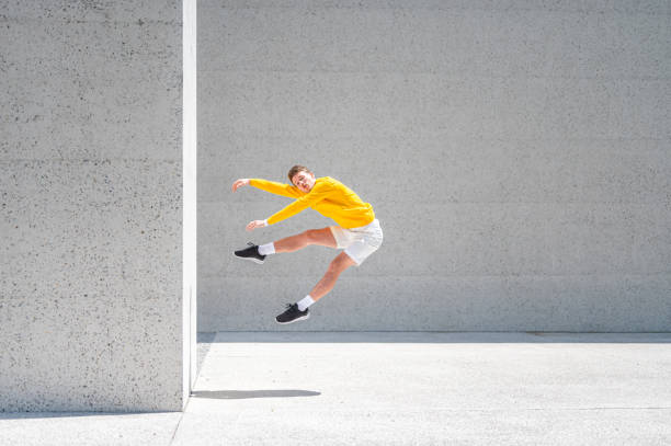 istock Young male dancer posing outdoors 1412852248